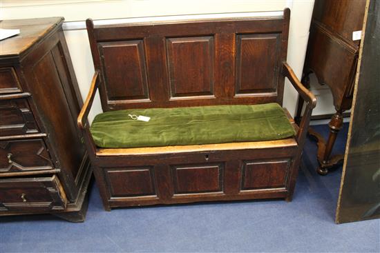 An 18th century oak box seat settle, W.3ft 9in.